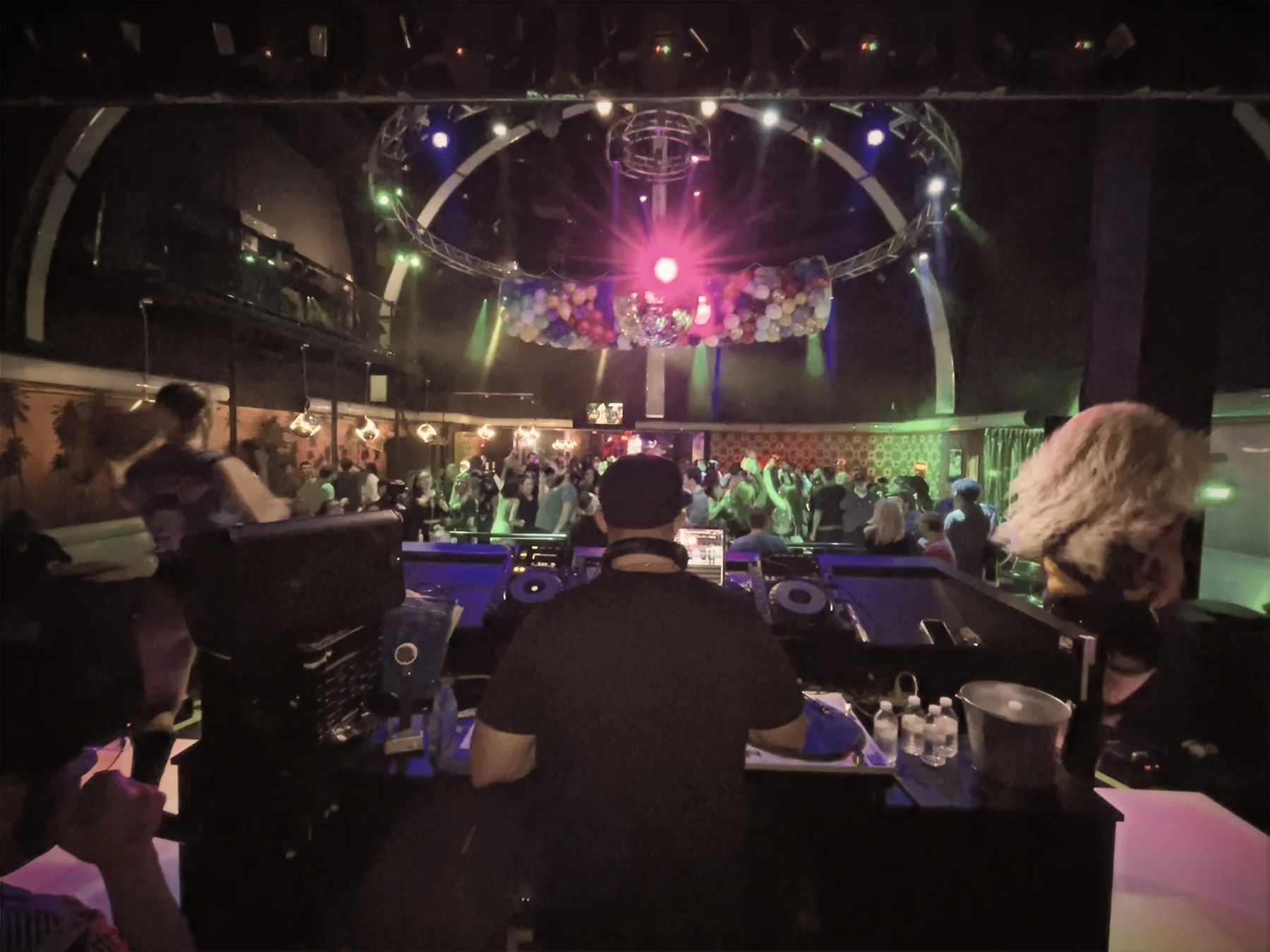 A packed dance floor from behind DJ Joey Dino’s booth