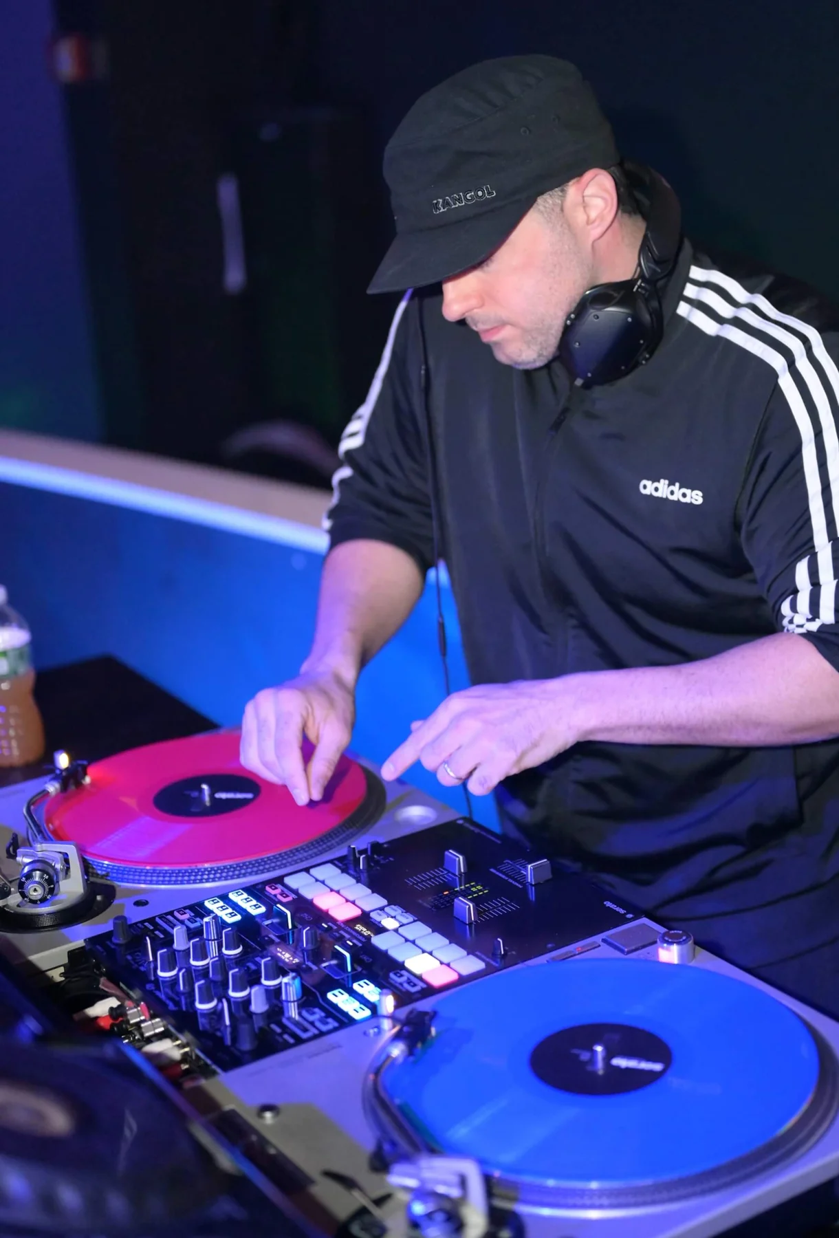 Joey Dino mixing music behind the decks